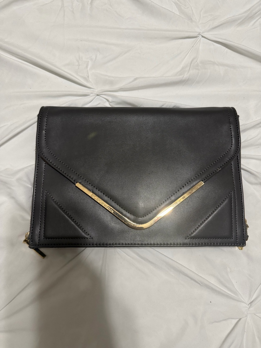 BCBGeneration Black Clutch with Gold V-Bar Accent